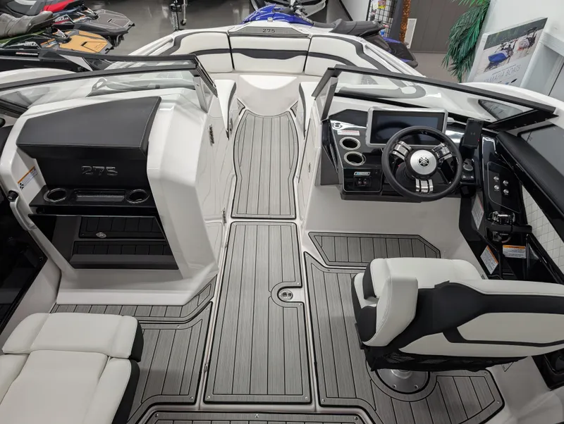 Slide: The Image of 2024 Yamaha Boats 275 SE interior with sleek design and modern dashboard features. - 5