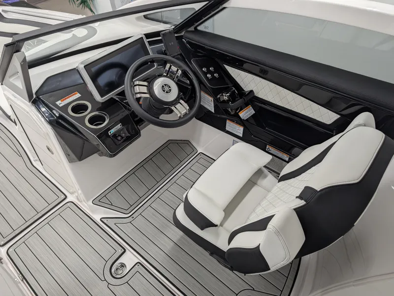 Slide: The Image of 2024 Yamaha Boats 275 SE cockpit with modern dashboard and luxurious seating. - 8
