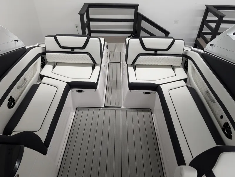 Slide: The Image of 2024 Yamaha Boats 275 SE interior with sleek white seating and modern design. - 9