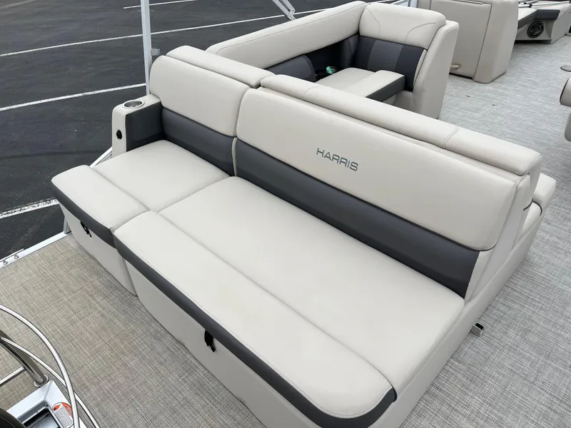Slide: The Image of 2022 Harris Cruiser 230 boat interior with plush seating and modern design. - 6