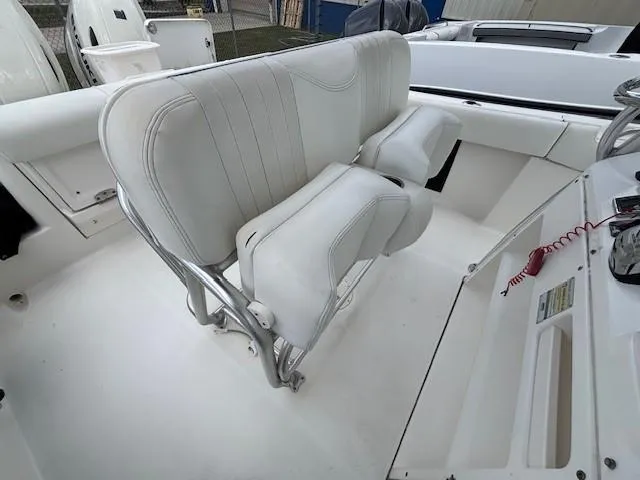 Slide: The Image of 2009 Robalo R240 Center Console boat with white seating and sleek interior design. - 12