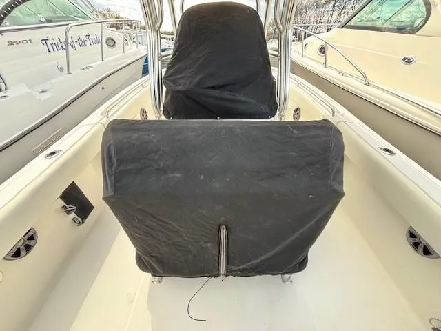 Slide: The Image of 2009 Robalo R240 Center Console boat interior with covered seating and console. - 17