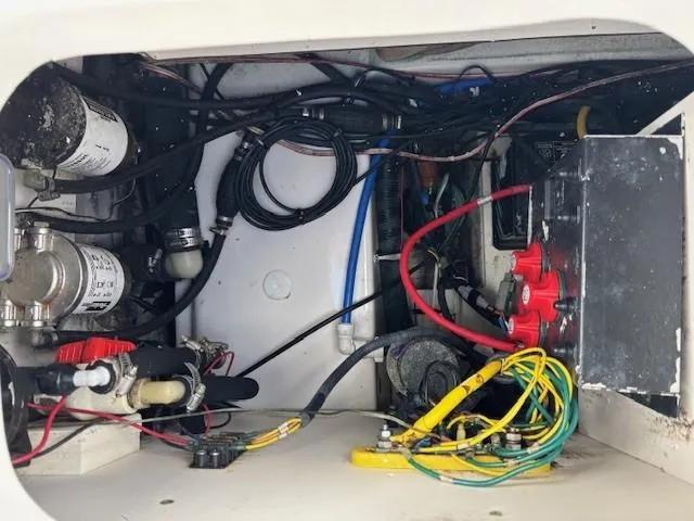 Slide: The Image of Electrical wiring and components inside a 2009 Robalo R240 Center Console boat. - 18