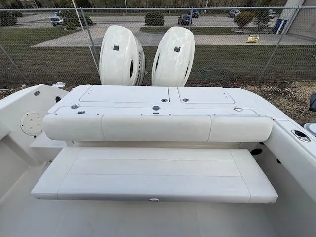 Slide: The Image of 2009 Robalo R240 Center Console boat with dual engines and spacious seating area. - 19