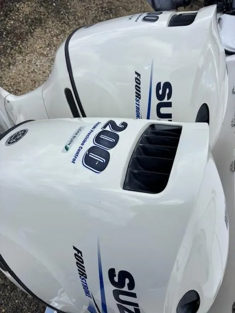 Slide: The Image of Twin Suzuki 200 horsepower four-stroke outboard engines on a 2009 Robalo R240 Center Console. - 20