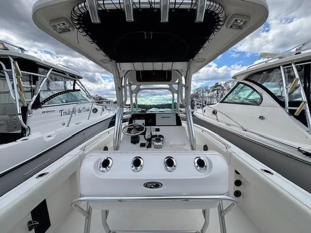 Slide: The Image of 2009 Robalo R240 Center Console boat with sleek design and modern controls. - 4
