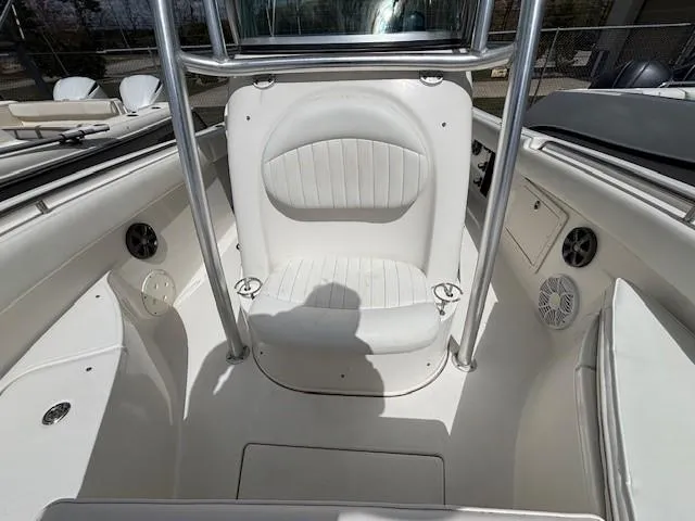 Slide: The Image of 2009 Robalo R240 Center Console boat interior with white seating and stainless steel frame. - 7