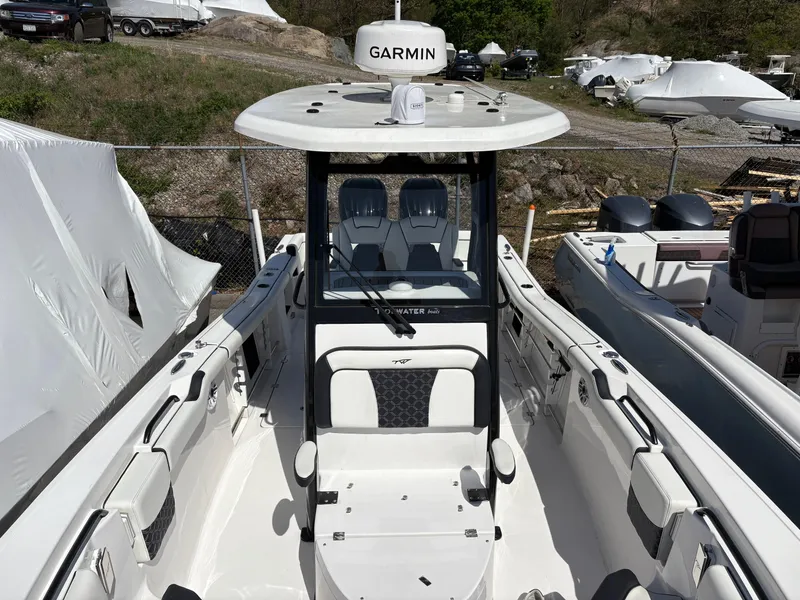 Slide: The Image of 2023 Tidewater 272 LXF boat with Garmin equipment, docked outdoors. - 11