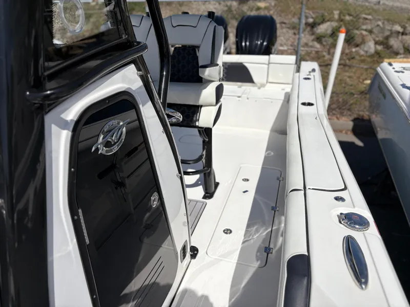 Slide: The Image of 2023 Tidewater 272 LXF boat interior, featuring sleek seating and modern design elements. - 12