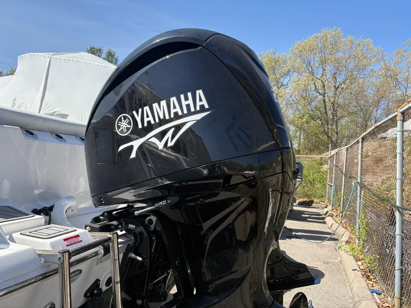 Slide: The Image of 2023 Tidewater 272 LXF with Yamaha outboard motor in a sunny outdoor setting. - 15