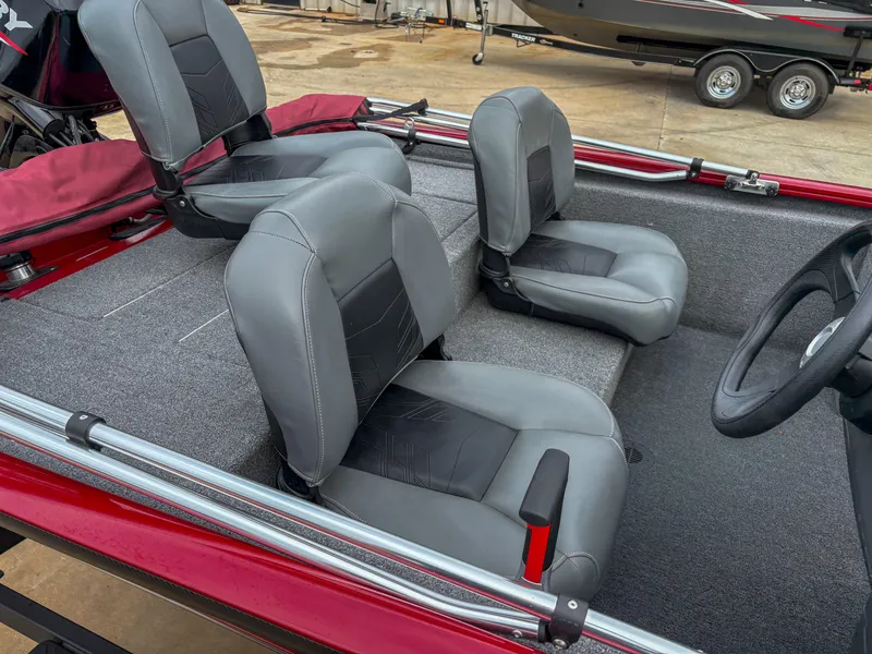 Slide: The Image of 2024 Tracker Pro 170 boat interior with gray and black seating. - 10