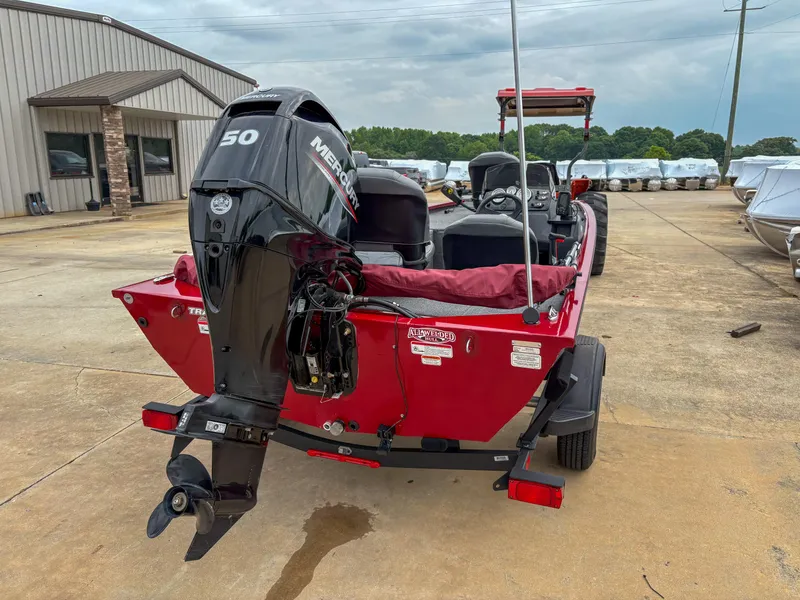 Slide: The Image of 2024 Tracker Pro 170 boat with Mercury 50 engine, parked outdoors. - 3