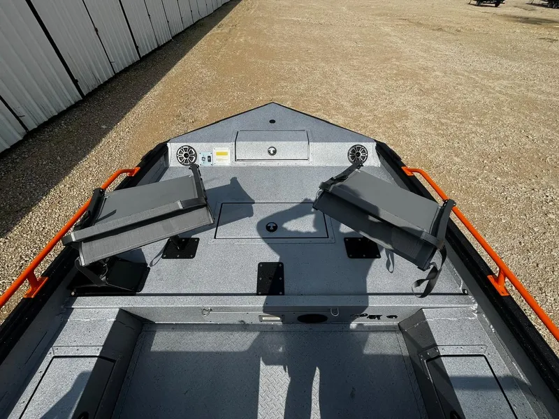 Slide: The Image of 2025 SeaArk ProCat 240 boat interior with seating and storage compartments. - 8