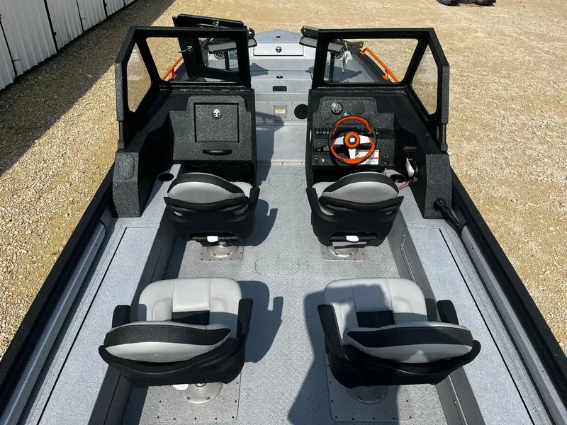 Slide: The Image of 2025 SeaArk ProCat 240 boat interior with four seats and steering console. - 9