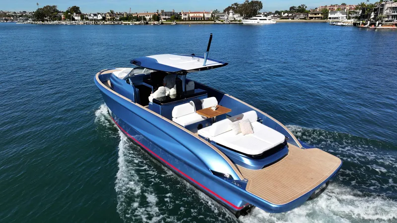 Slide: The Image of 2023 Solaris Power 40 Open yacht cruising on a sunny day in a serene waterway. - 0