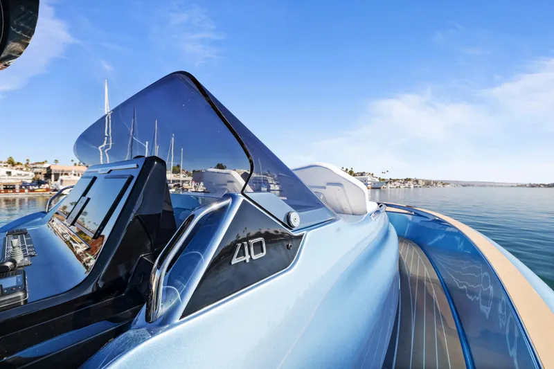 Slide: The Image of 2023 Solaris Power 40 Open yacht on calm water, showcasing sleek design and modern features. - 10