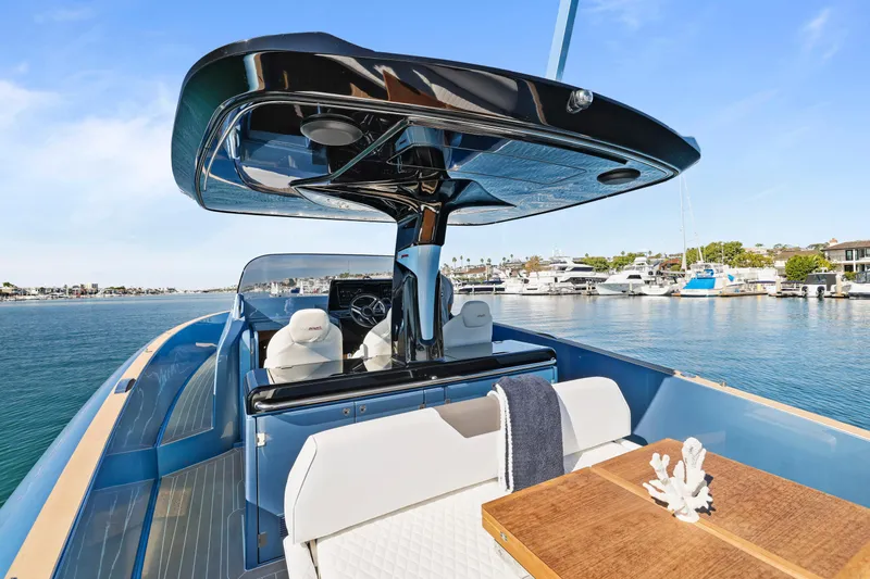 Slide: The Image of 2023 Solaris Power 40 Open yacht with sleek design, docked in a marina. - 11