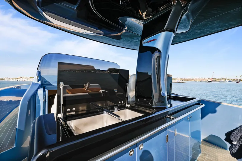 Slide: The Image of 2023 Solaris Power 40 Open yacht with sleek outdoor kitchen and ocean view. - 15