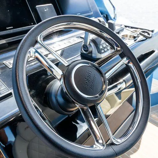 Slide: The Image of Steering wheel of 2023 Solaris Power 40 Open yacht, featuring sleek design and modern controls. - 19