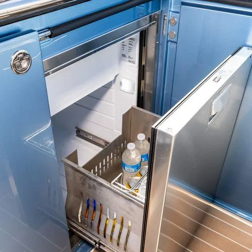 Slide: The Image of Mini fridge on Solaris Power 40 Open yacht, stocked with water bottles and snacks, 2023 model. - 20
