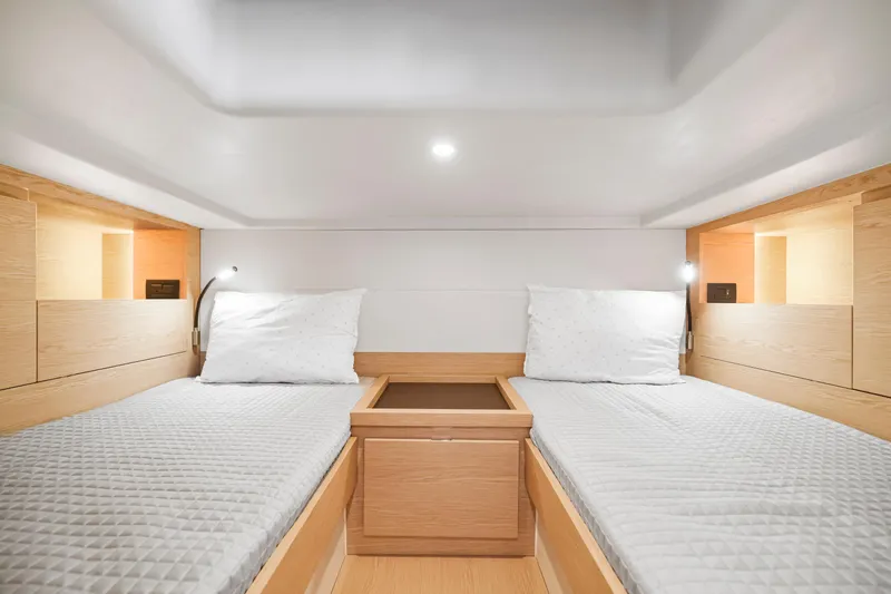 Slide: The Image of 2023 Solaris Power 40 Open cabin with twin beds and modern wooden interior. - 27