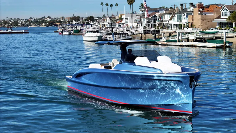 Slide: The Image of 2023 Solaris Power 40 Open yacht cruising in a scenic marina setting. - 3