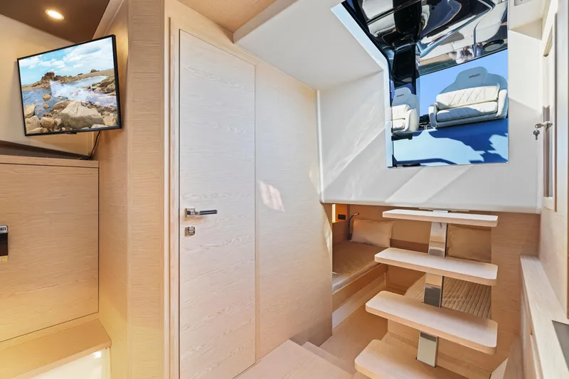 Slide: The Image of Interior of 2023 Solaris Power 40 Open yacht with modern design and wooden stairs. - 30