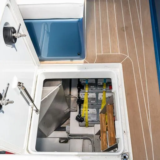 Slide: The Image of 2023 Solaris Power 40 Open yacht battery compartment with wooden deck and storage area. - 32