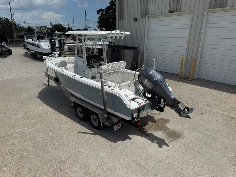 Slide: The Image of 2021 Sea Hunt Ultra 219 boat with Yamaha outboard motor on trailer. - 2