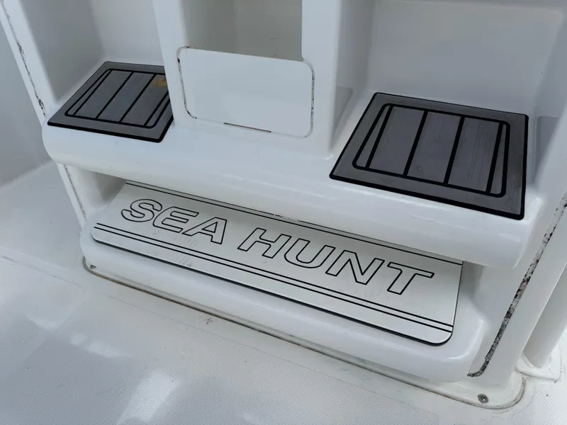 Slide: The Image of 2021 Sea Hunt Ultra 219 boat step with logo and non-slip pads. - 31