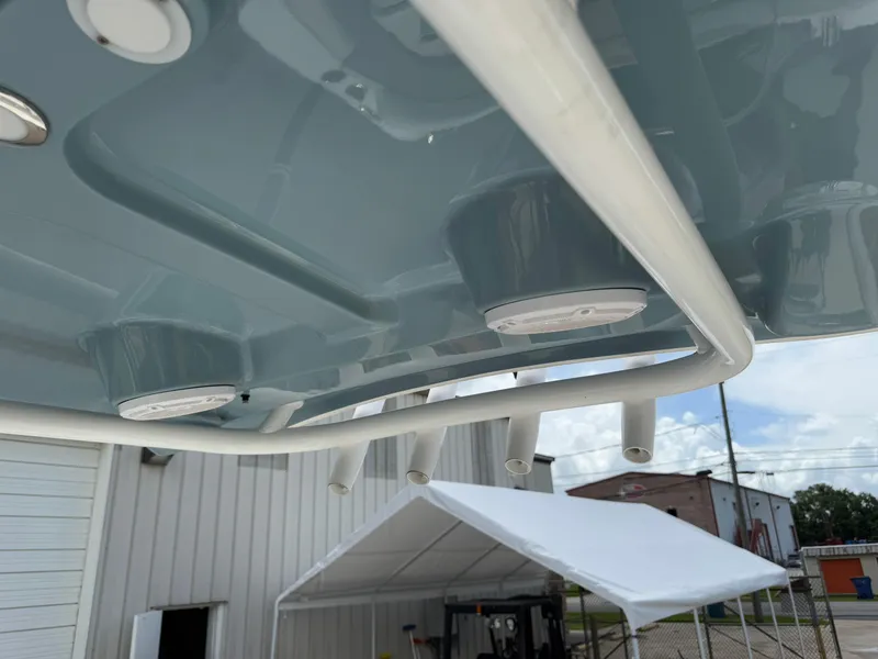 Slide: The Image of 2021 Sea Hunt Ultra 219 boat's underside view with speakers and rod holders. - 36