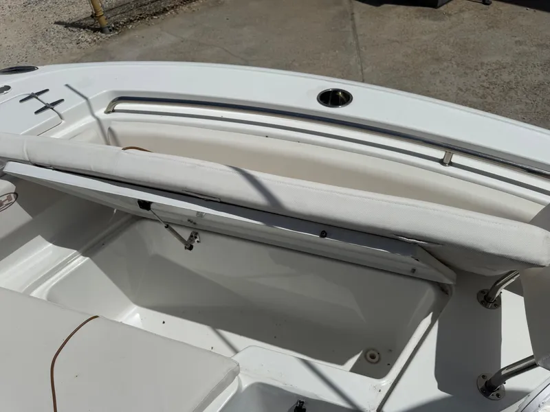 Slide: The Image of 2021 Sea Hunt Ultra 219 boat interior with seating and storage compartments. - 42