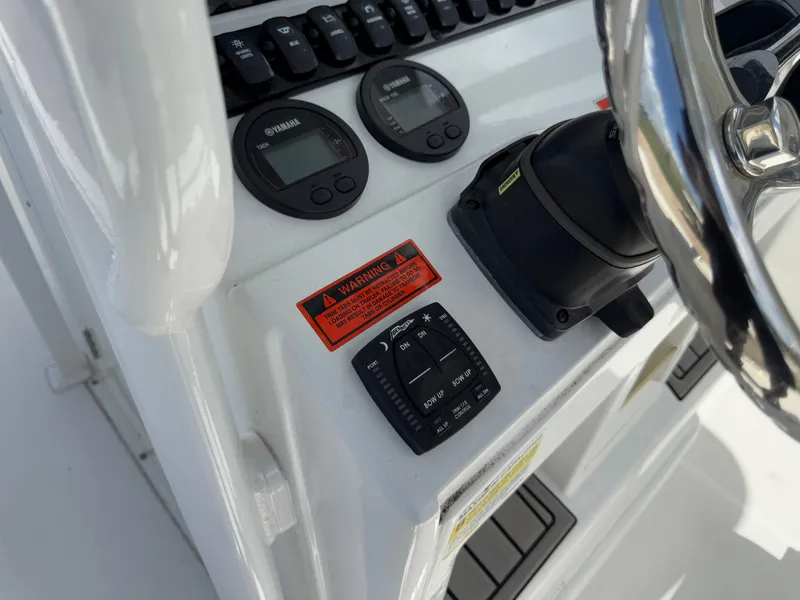 Slide: The Image of Control panel of 2021 Sea Hunt Ultra 219 boat with steering wheel and gauges. - 45