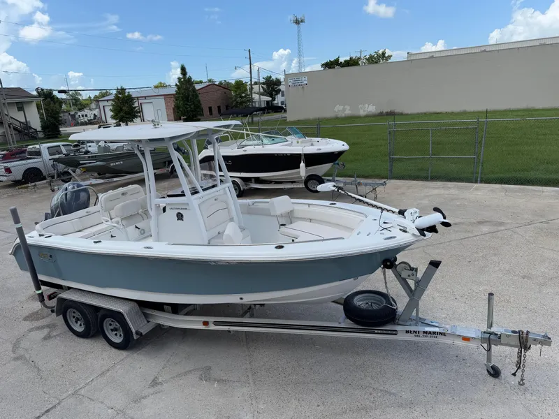 Slide: The Image of 2021 Sea Hunt Ultra 219 boat on trailer in parking lot. - 5