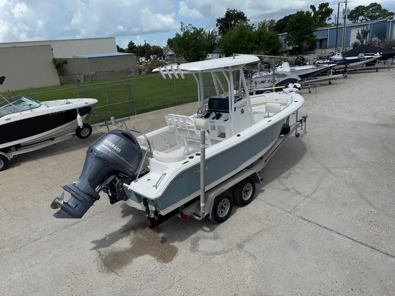 Slide: The Image of 2021 Sea Hunt Ultra 219 boat on trailer with Yamaha outboard motor. - 8
