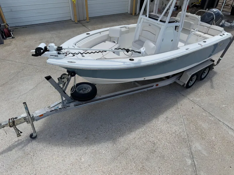 Slide: The Image of 2021 Sea Hunt Ultra 219 boat on trailer, parked outdoors, ready for transport. - 9