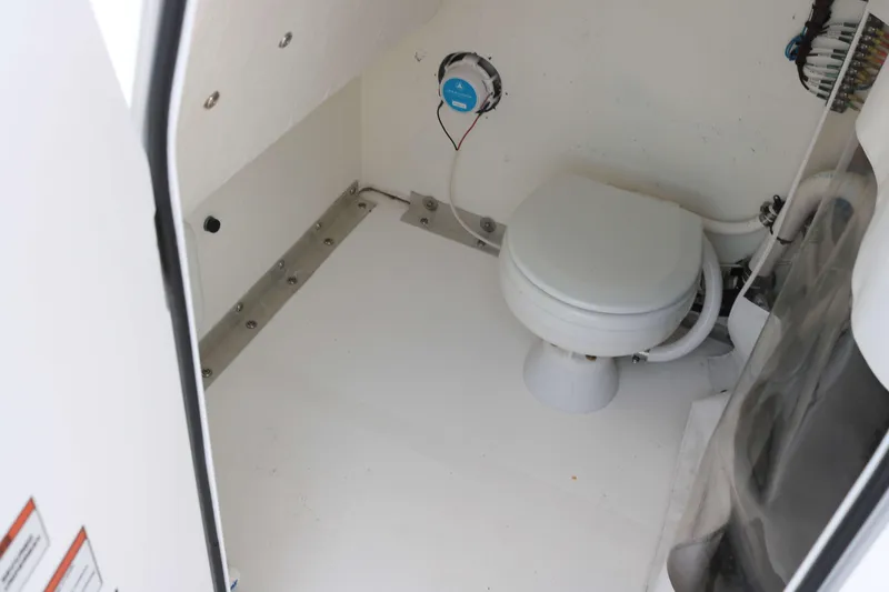 Slide: The Image of 2022 Twin Vee 340 GFX boat interior with toilet and speaker. - 10