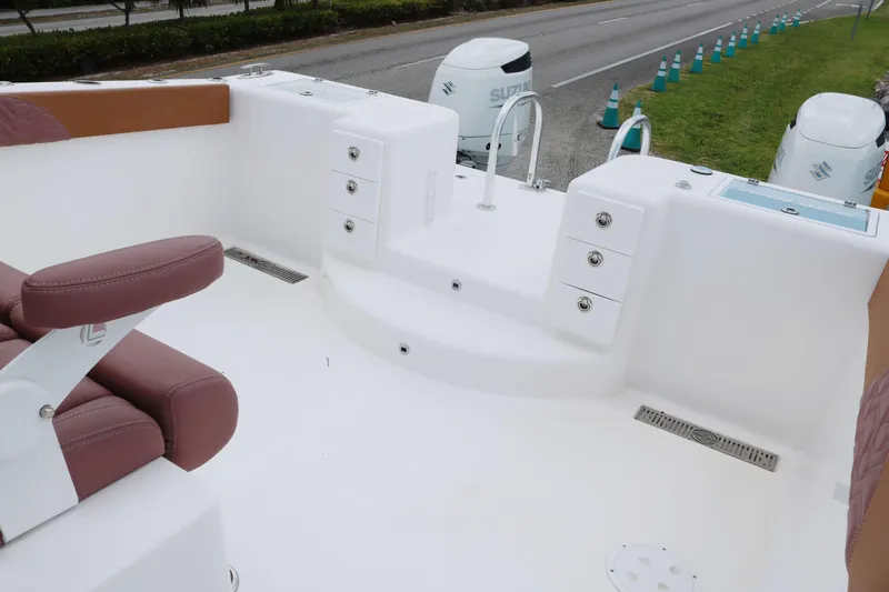 Slide: The Image of 2022 Twin Vee 340 GFX boat interior with seating and storage compartments. - 13