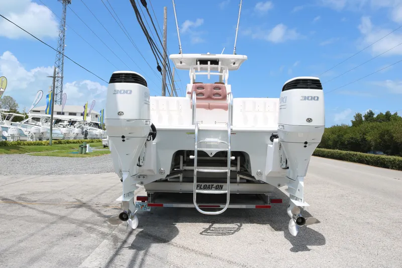 Slide: The Image of 2022 Twin Vee 340 GFX boat with dual 300 horsepower engines on a trailer. - 4