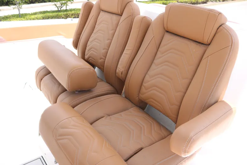 Slide: The Image of Luxurious tan leather seats in 2022 Twin Vee 340 GFX boat. - 7