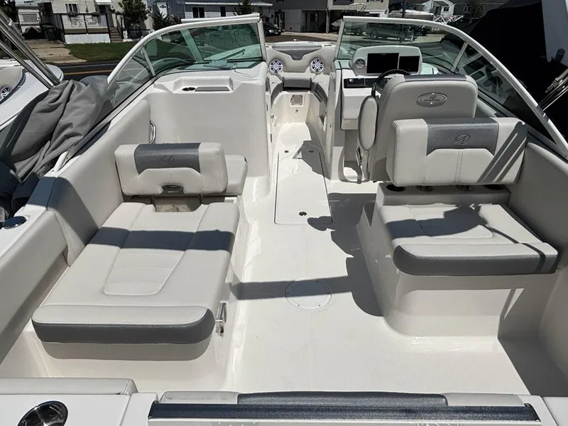 Slide: The Image of 2026 Sailfish 236 DC boat interior with white seating and modern dashboard. - 16