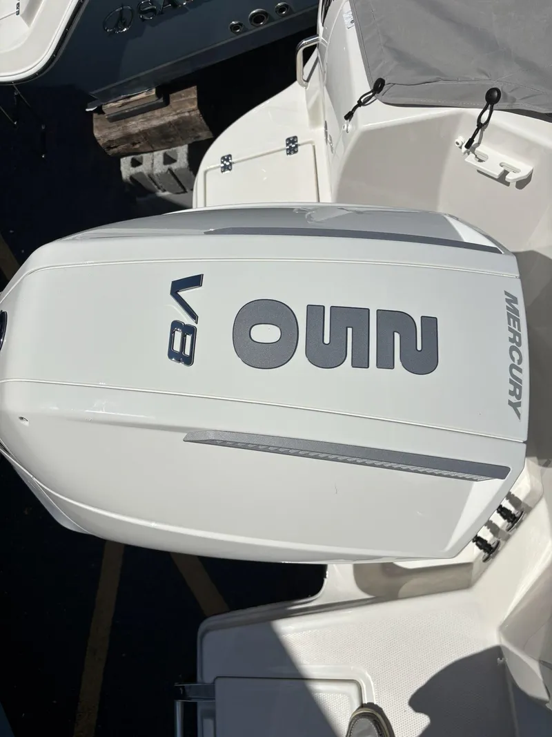 Slide: The Image of 2026 Sailfish 236 DC with Mercury V8 outboard engine. - 19