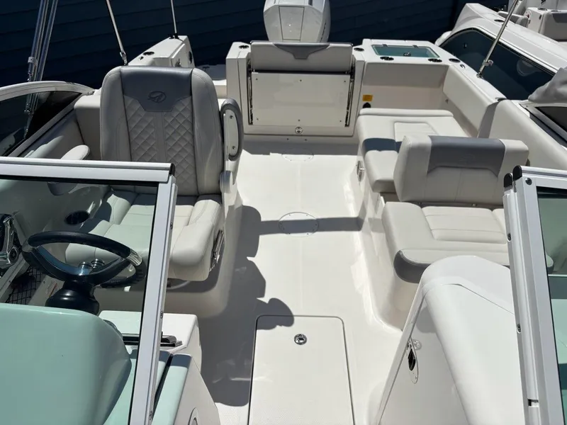 Slide: The Image of 2026 Sailfish 236 DC boat interior with modern seating and steering wheel. - 6