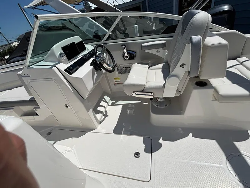 Slide: The Image of 2026 Sailfish 236 DC boat interior with modern helm and comfortable seating. - 7