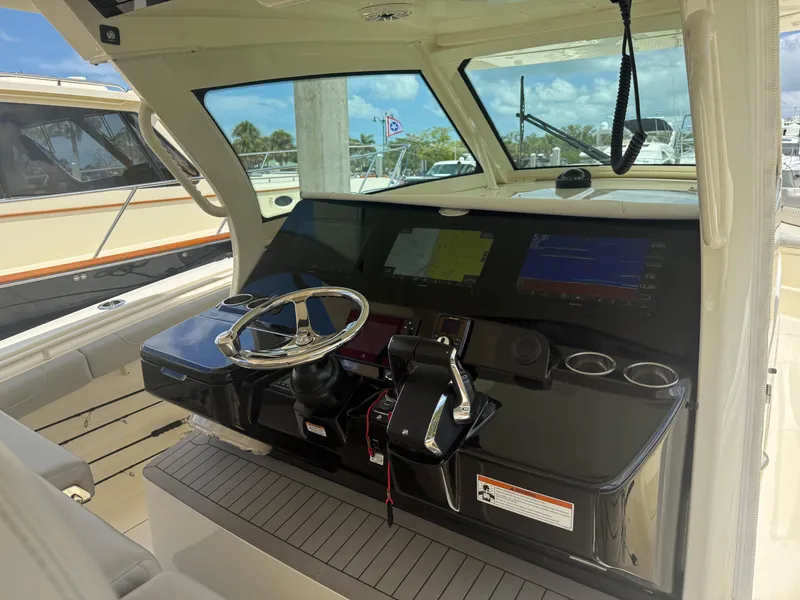 Slide: The Image of 2022 Scout 425 LXF boat helm with modern controls and navigation screens. - 18