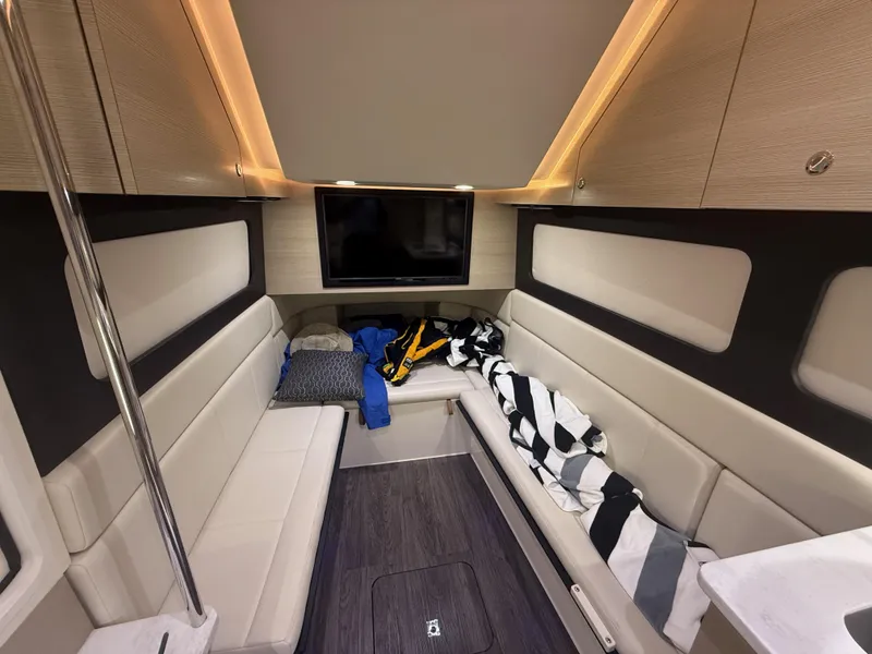 Slide: The Image of Luxurious interior of 2022 Scout 425 LXF boat with seating and TV. - 30