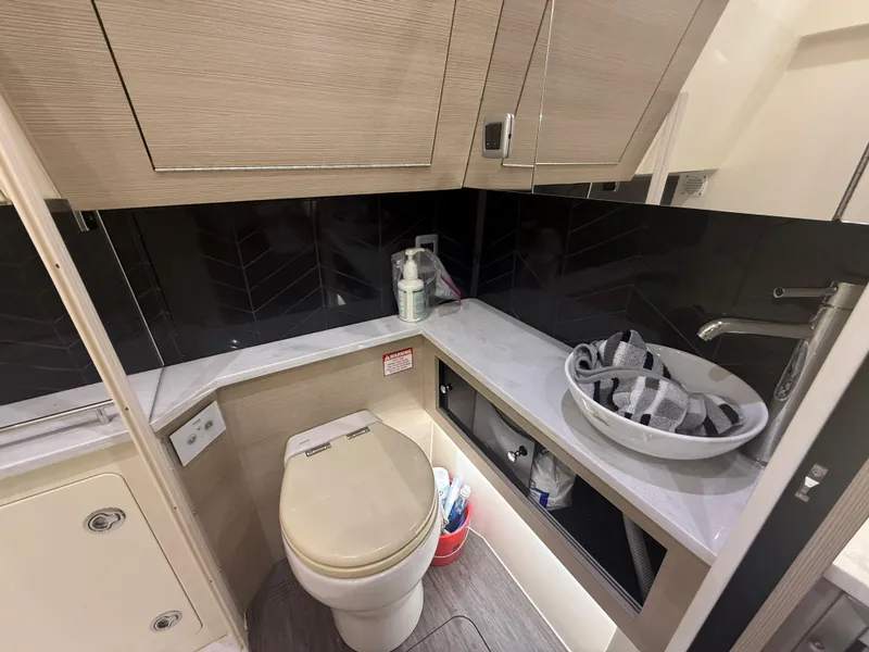 Slide: The Image of Modern bathroom in 2022 Scout 425 LXF boat with sleek fixtures and storage. - 33