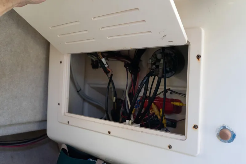 Slide: The Image of Open electrical panel inside 2005 Parker 2520 Deep Vee Sport Cabin boat. - 33