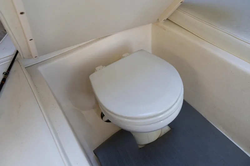 Slide: The Image of 2005 Parker 2520 Deep Vee Sport Cabin boat toilet interior. - 35