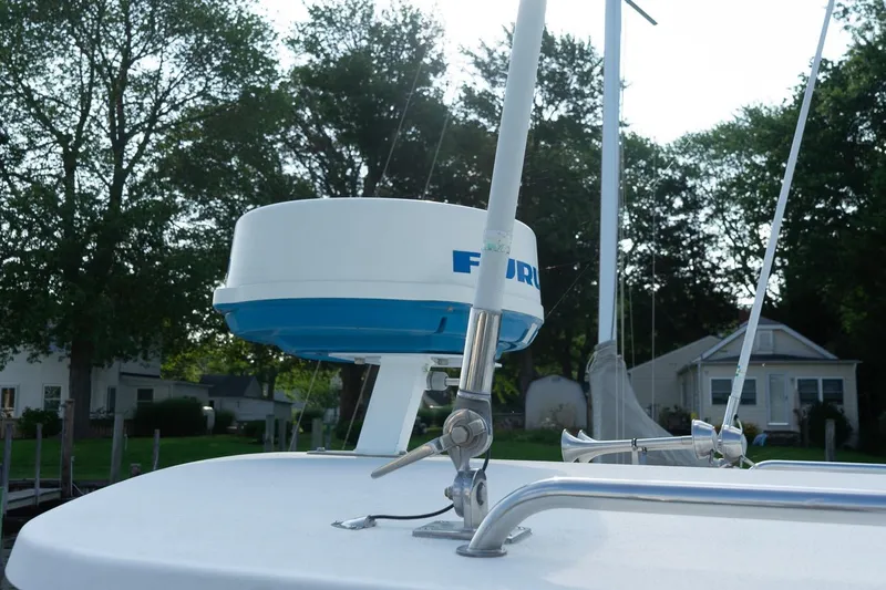 Slide: The Image of Radar equipment on 2005 Parker 2520 Deep Vee Sport Cabin boat, surrounded by trees. - 37